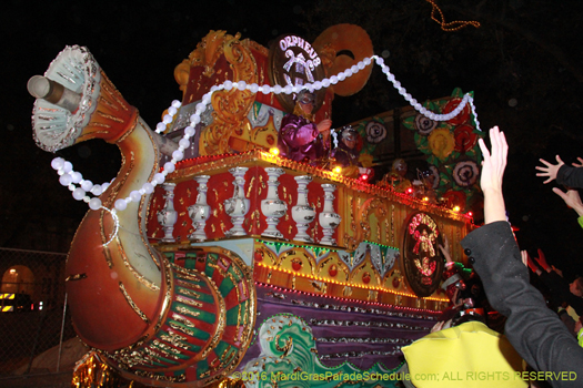 Having Mardi Gras fun at the Krewe of Orpheus - photo by Jules Richard
