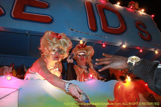 Tons of Krewe emblemed throws are available during the Krewe of Muses parade in New Orleans Mardi Gras - photo by Jules Richard